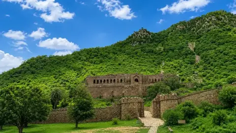 Bandhavgarh Fort on the green hill above the forest of Bandhavgarh National Park