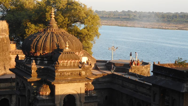 Temple structures within Ahilya Fort overlooking the Narmada