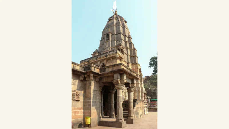 Stone tower and carved entrance of Mamleshwar Temple