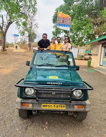Guest family in a safari gypsy at the park gate