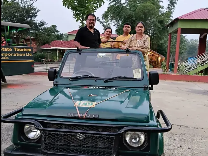 Banjari MP Tours guests standing in an open safari Gypsy before a jungle safari